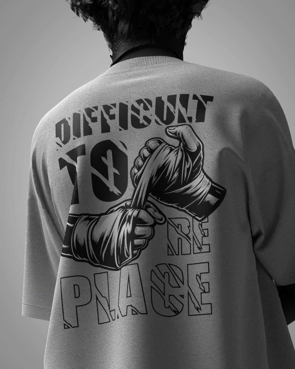 Designosor Irreplaceable white oversized t-shirt back with defiant fists graphic and typography